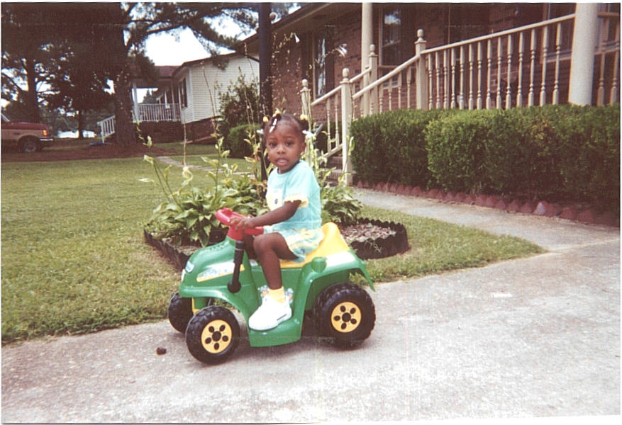 Keyonna on her tractor